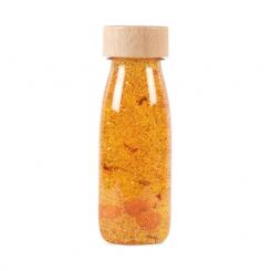 Botella sensorial Petit Boum Float Cúrcuma